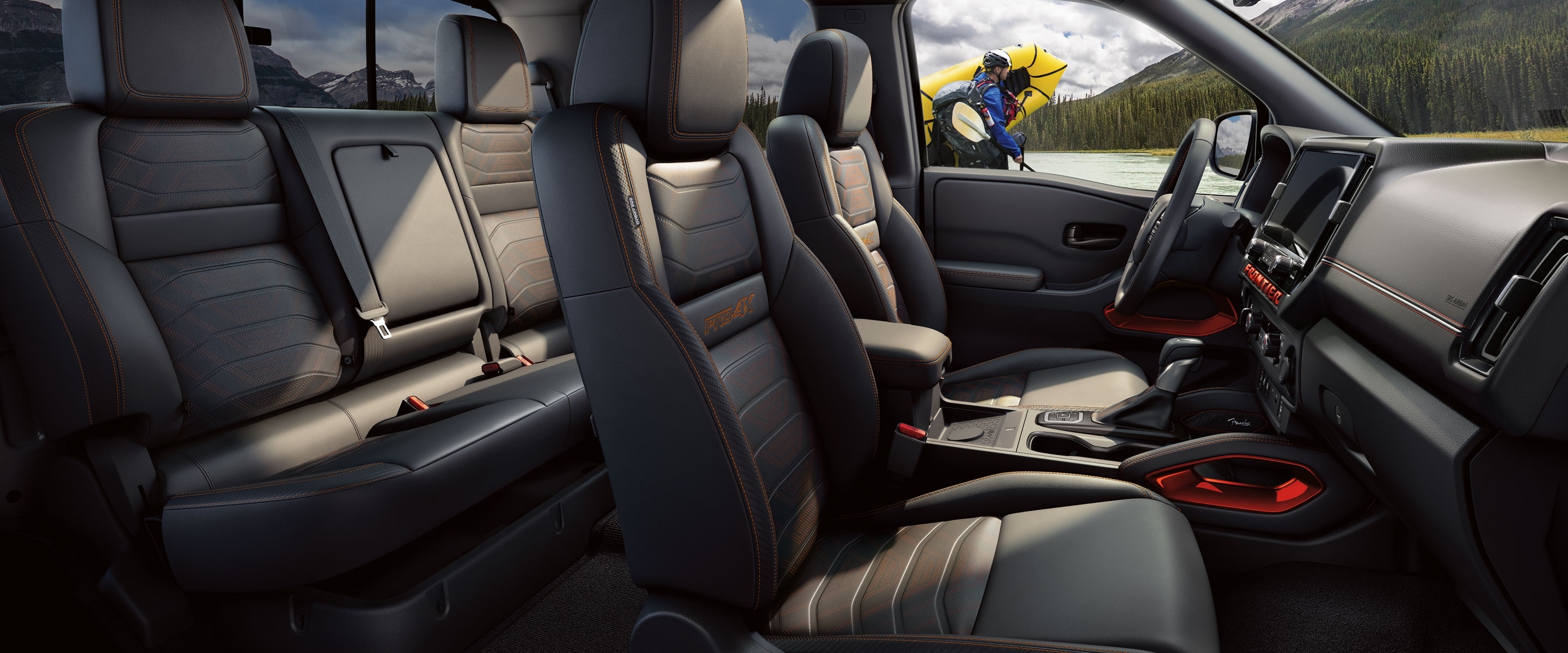 2027 Nissan Frontier PRO-4X Crew Cab interior with front and rear seats.