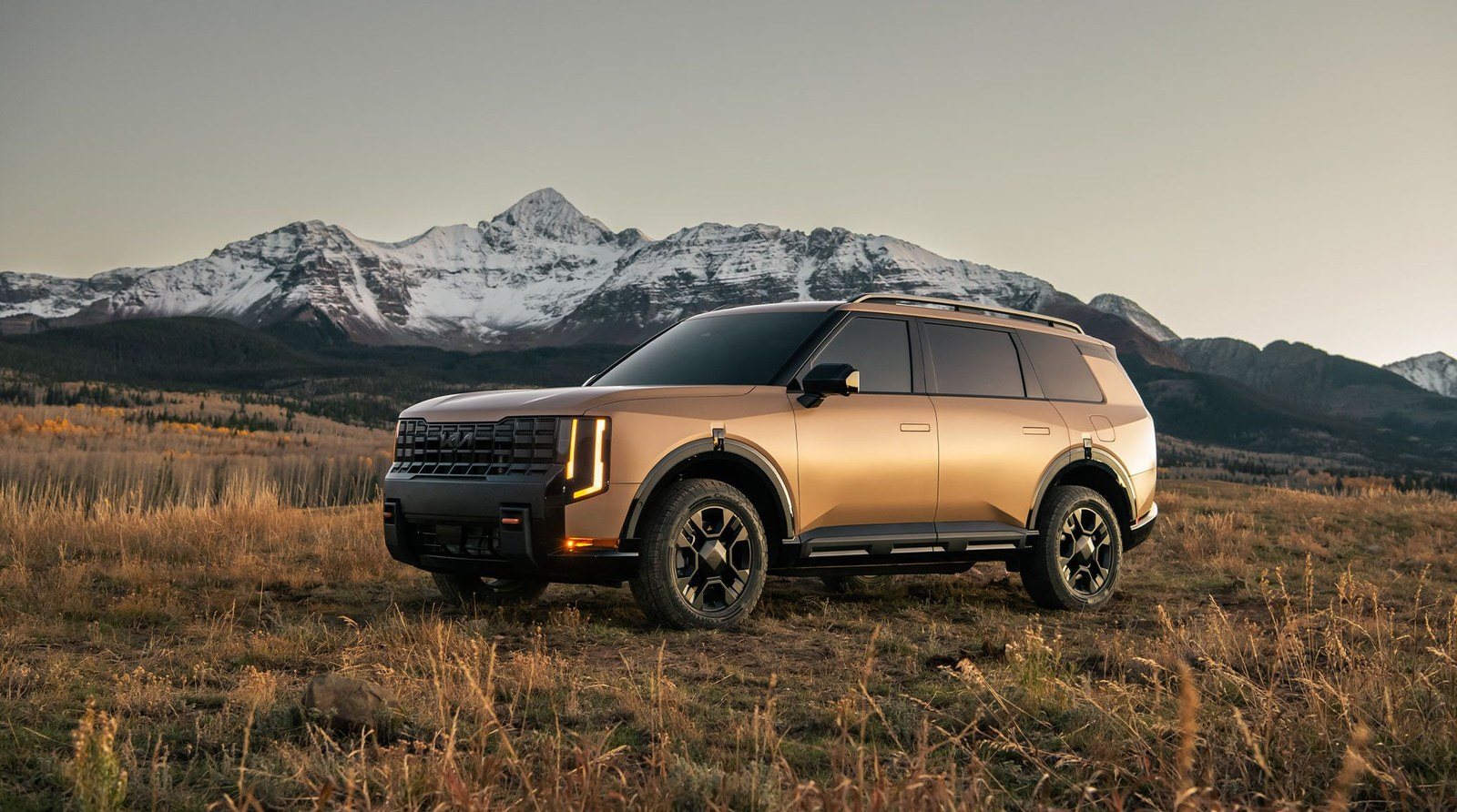 2027 Kia Telluride X-Pro three-row SUV with AWD in a mountain meadow