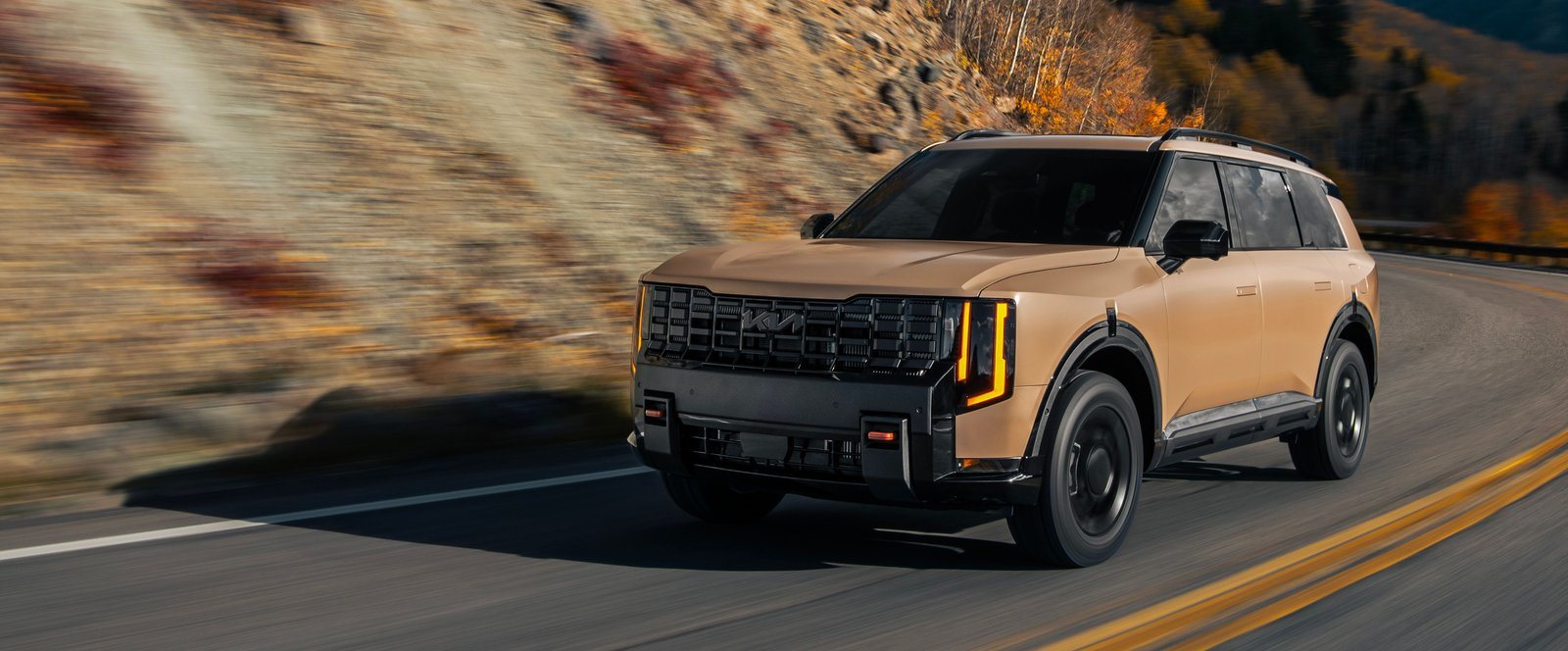 2027 Kia Telluride X-Pro driving on a Colorado mountain road