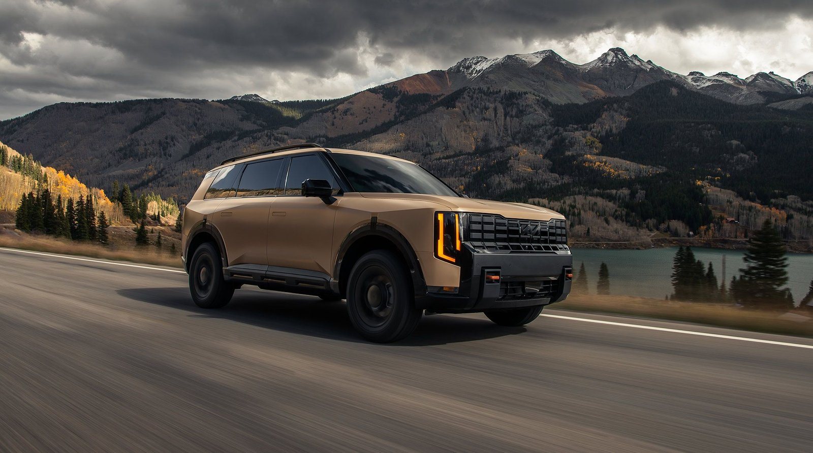 2027 Kia Telluride driving on a mountain highway in Colorado