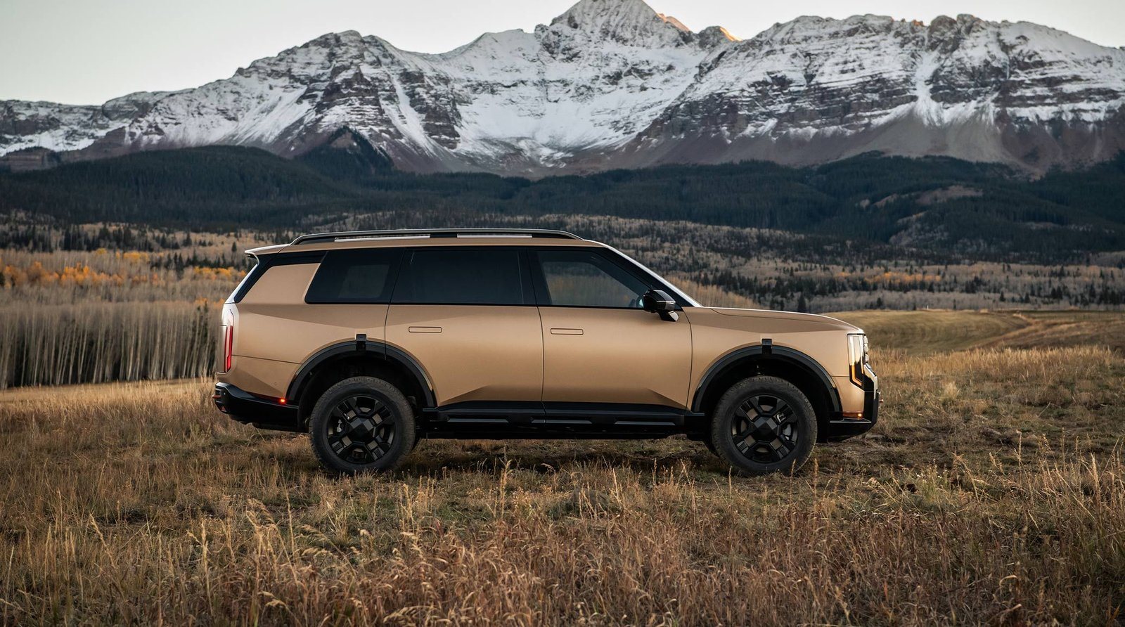 2027 Kia Telluride X-Pro parked in a Colorado meadow below snowy peaks