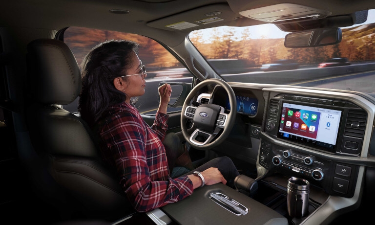 26Ford-F150-InteriorWithHandsOffDriver