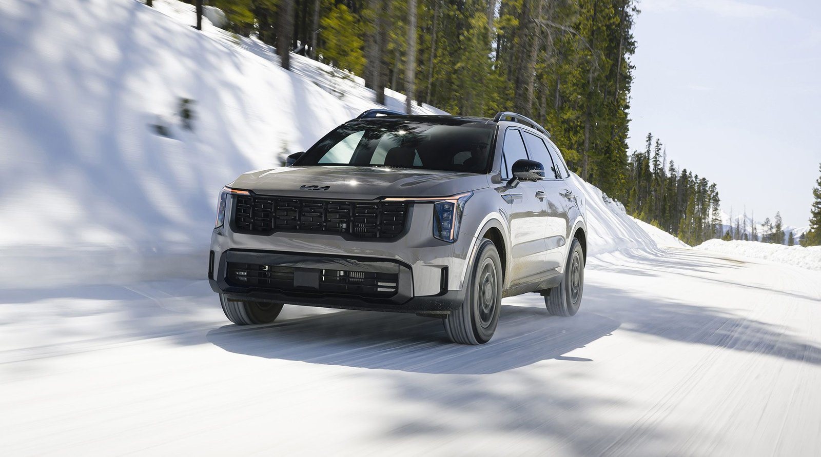2027 Kia Sorento X-Pro driving on a snowy mountain road