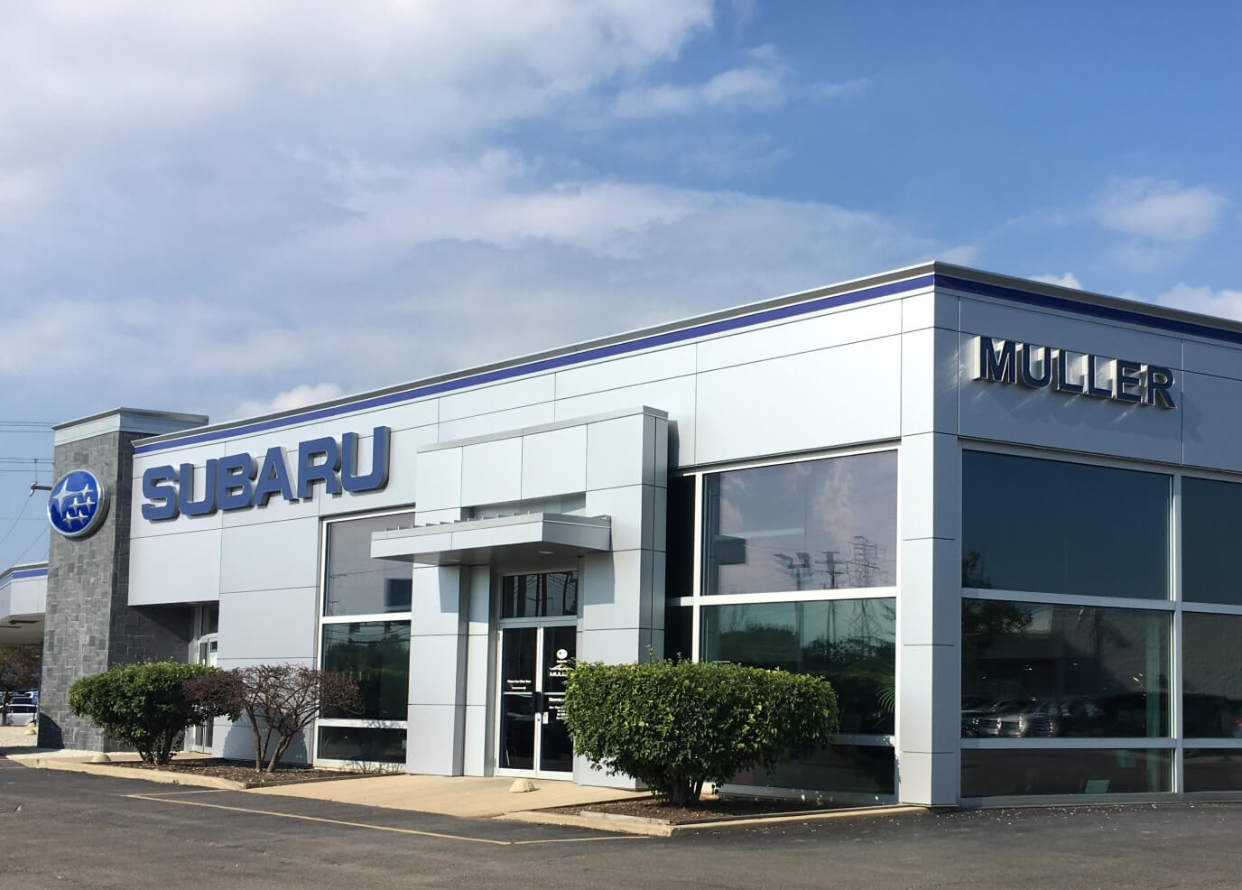Street view of Muller Subaru on a clear sunny day.