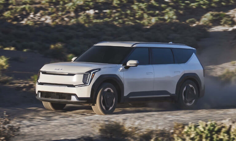 2024 Kia EV9 driving in dusty desert